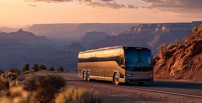 Tour bus rolling through canyon country at golden hour